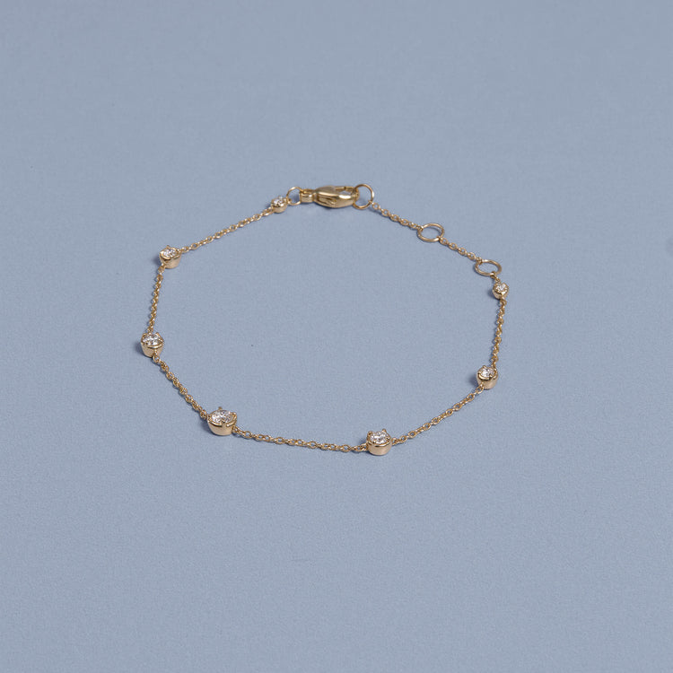 Stone and Strand 14K Yellow Gold Ambroeus Diamond Station Bracelet Editorial Image