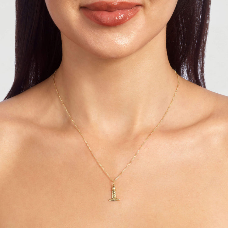 Image of 10K Yellow Gold Back To Shore Lighthouse Necklace on Models Neck