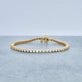 Stone and Strand 14K Yellow Gold Baseline Eternity Tennis Bracelet Editorial Image