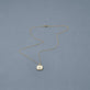 Stone and Strand 14K Yellow Gold Beekman Birthstone Locket Necklace Editorial Image
