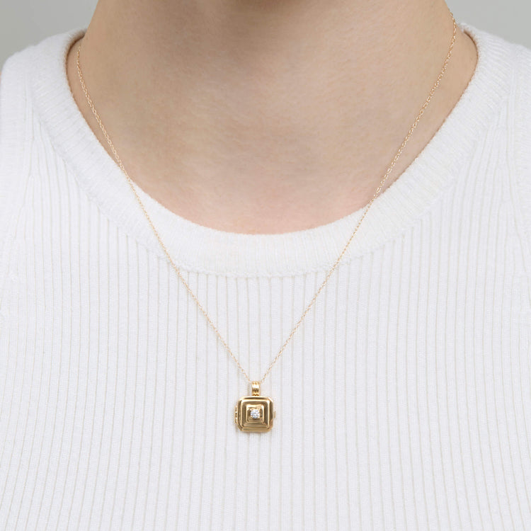 Image of 10K Yellow Gold Beekman Birthstone Locket Necklace on Models Neck