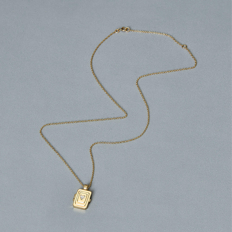 Stone and Strand 14K Yellow Gold Beekman Heart Locket Necklace Editorial Image