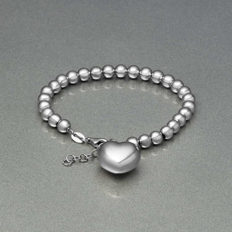 Stone and Strand Sterling Silver Big Hearted Puffed Bracelet Editorial Image