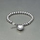 Stone and Strand Sterling Silver Big Hearted Puffed Bracelet Editorial Image