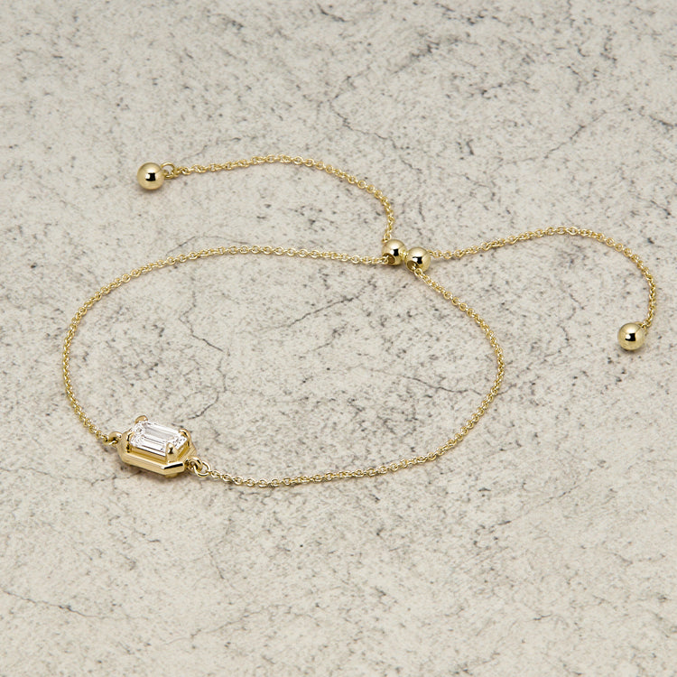 Stone and Strand 14K Yellow Gold Birthstone Emerald Cut Bonbon Bracelet with White Topaz Editorial Image
