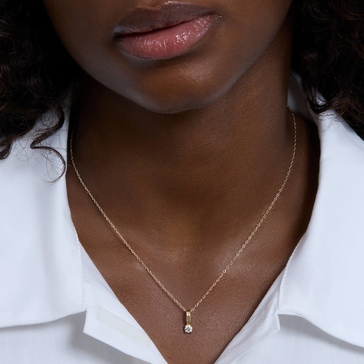 Image of 14K Yellow Gold Birthstone Flow Charm on Models Neck
