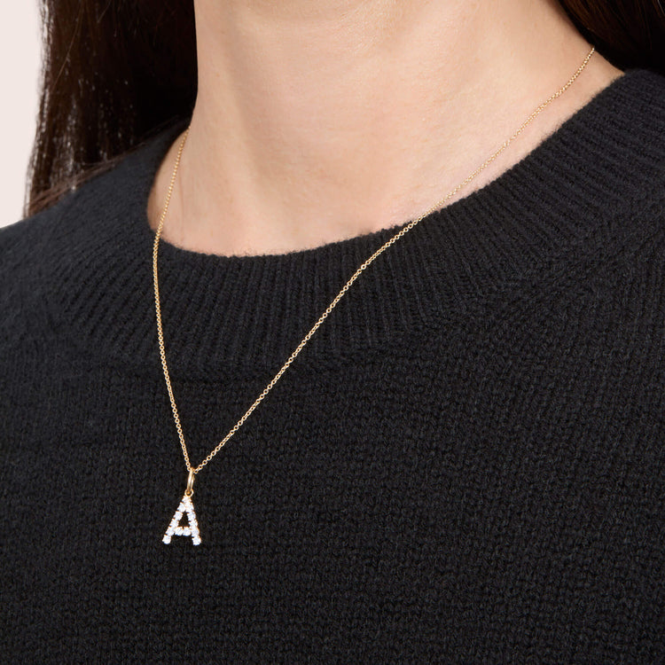 Image of 14K Yellow Gold Bold Diamond Initial Necklace on Models Neck