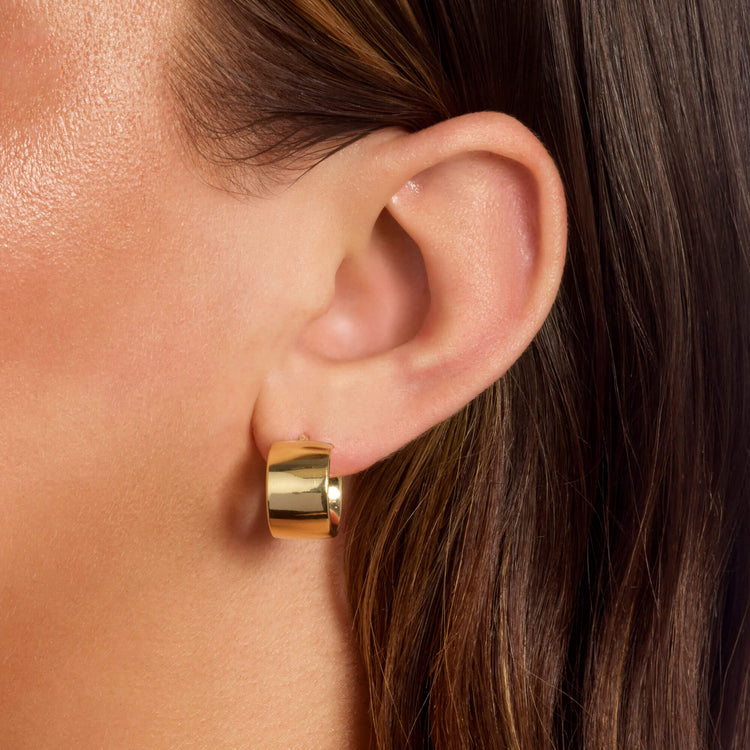 Image of 10K Yellow Gold Bold Glider Hoops on Models Ear