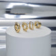 Still life image of In A Twist Gold Hoops with Stone and Strand solid gold jewelry