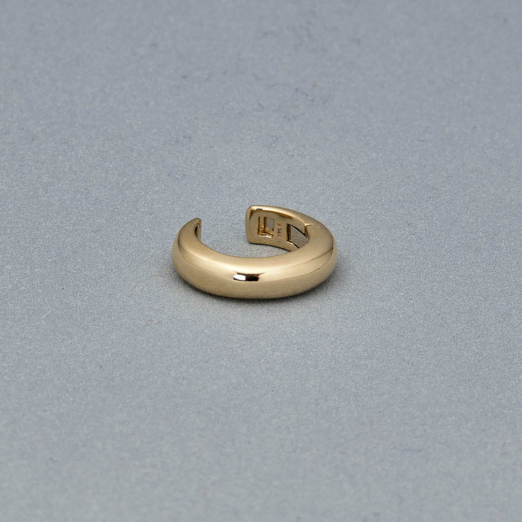 Stone and Strand 14K Yellow Gold Bold Puff Ear Cuff Editorial Image