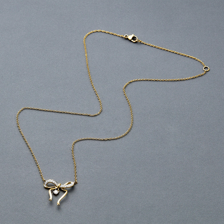 Stone and Strand 14K Yellow Gold Bow Nouveau Diamond Necklace Editorial Image