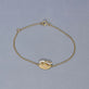 Stone and Strand 10K Yellow Gold Bow Nouveau Diamond ID Bracelet Editorial Image