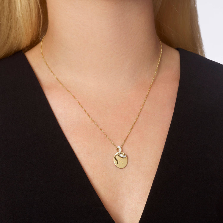 Image of 10K Yellow Gold Bow Nouveau Diamond Medallion Necklace on Models Neck