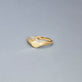 Stone and Strand 10K Yellow Gold Bow Nouveau Diamond Signet Ring Editorial Image