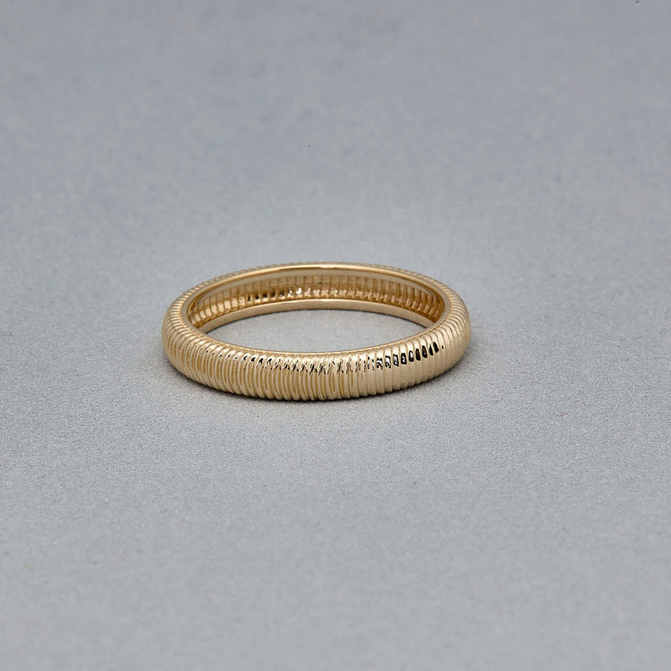 Stone and Strand 14K Yellow Gold Bowie Band Editorial Image