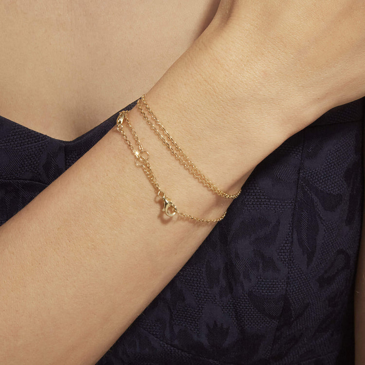 Image of 14K Yellow Gold Pivot by Stone and Strand 4-Way DC Cable Chain on Models Arm
