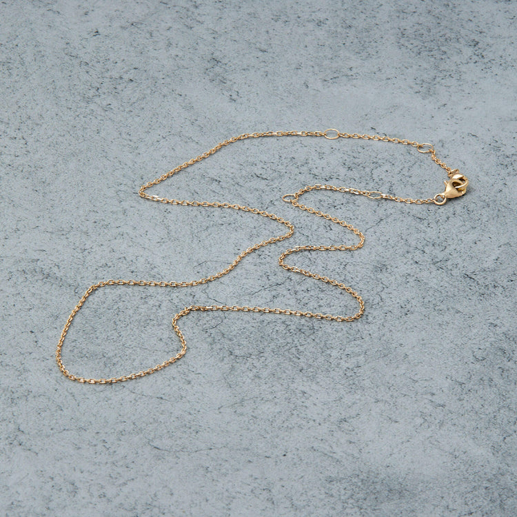 Stone and Strand 14K Yellow Gold Pivot by Stone and Strand 4-Way DC Cable Chain Editorial Image