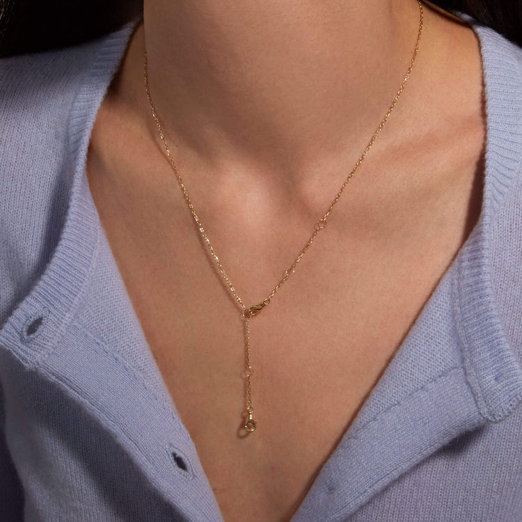 Image of 14K Yellow Gold Pivot by Stone and Strand 4-Way DC Cable Chain on Models Neck