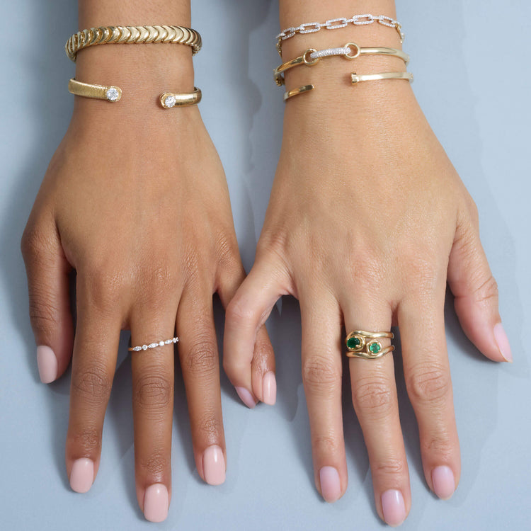Model wearing Diamond Bridle Bangle with solid gold Stone and Strand jewelry