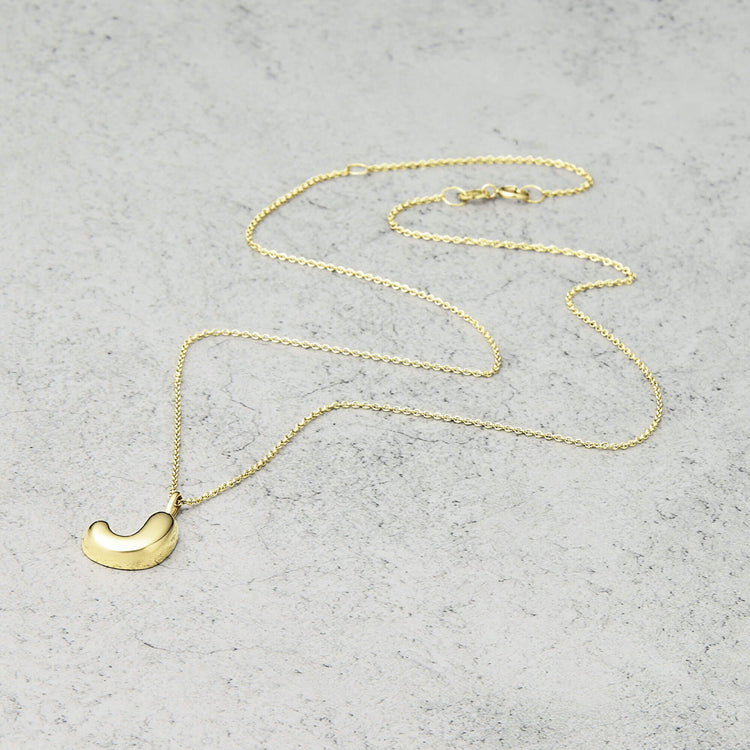Stone and Strand 14K Yellow Gold Bubble Tea Initial Necklace J Initial Editorial Image