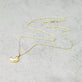 Stone and Strand 14K Yellow Gold Bubble Tea Initial Necklace J Initial Editorial Image