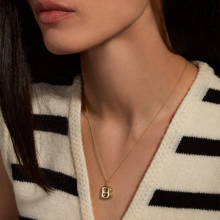 Image of 14K Yellow Gold Bubble Tea Initial Necklace on Models Neck