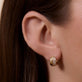 Image of 14K Yellow Gold Buvette Diamond Pave Huggie Earrings on Models Ear