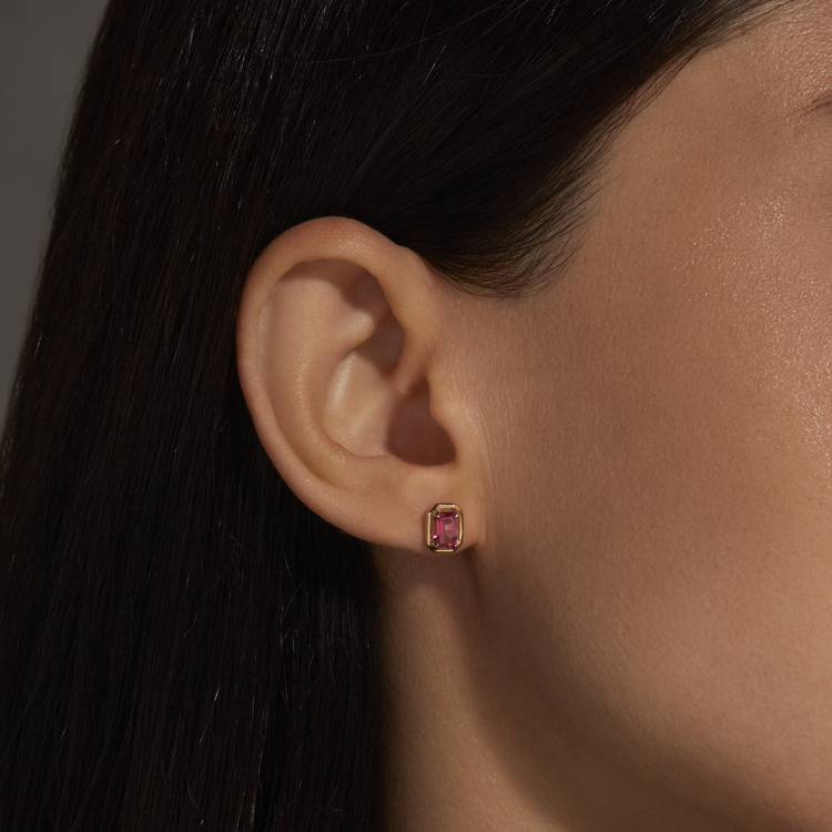 Image of 14K Yellow Gold Birthstone Emerald Cut Bonbon Studs with Garnet on Models Ear