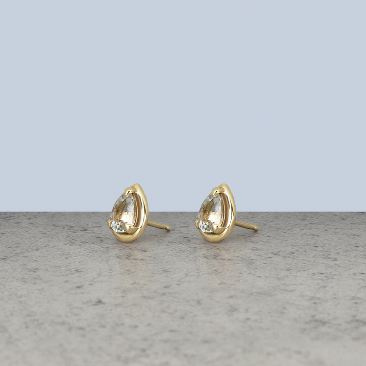 Stone and Strand 14K Yellow Gold Birthstone Pear Bonbon Studs with White Topaz Editorial Image