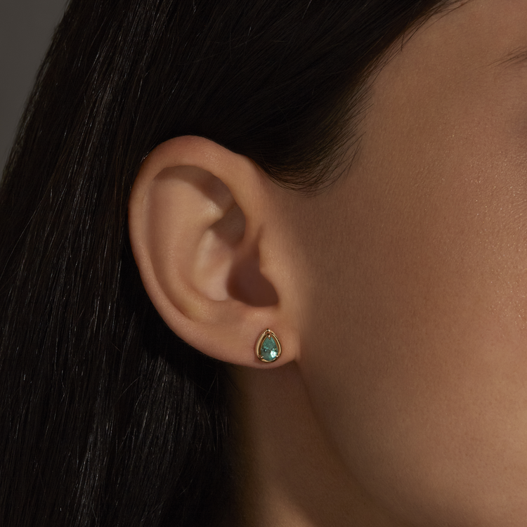 Image of 14K Yellow Gold Birthstone Pear Bonbon Studs with Emerald on Models Ear