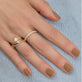 Image of Bold Diamond Eternity Ring On Model with other Stone and Strand Jewelry