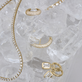 Still Life Image of Bold Pave Suspender and other Stone And Strand Jewelry 