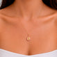 Image of 10K Yellow Gold Cat Of Fortune Gold Charm on Models Neck