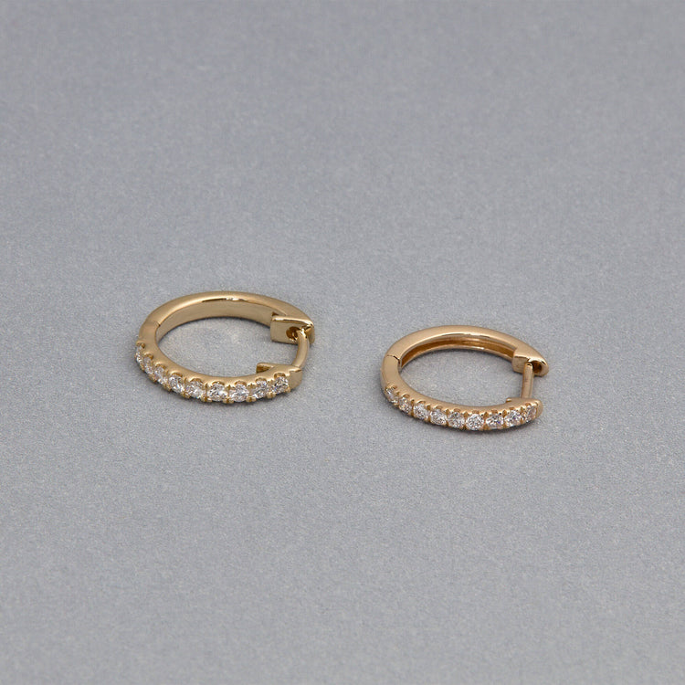 Stone and Strand 14K Yellow Gold Classic Pave Huggies Editorial Image