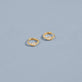 Stone and Strand 14K Yellow Gold Cobra Diamond Wave Ear Huggies Editorial Image