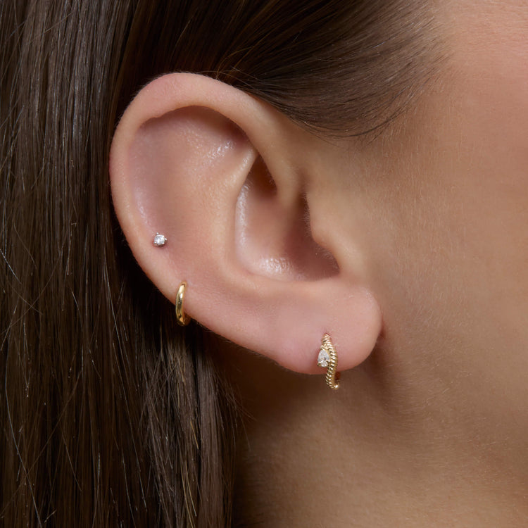 Image of 14K Yellow Gold Cobra Diamond Wave Ear Huggies on Models Ear