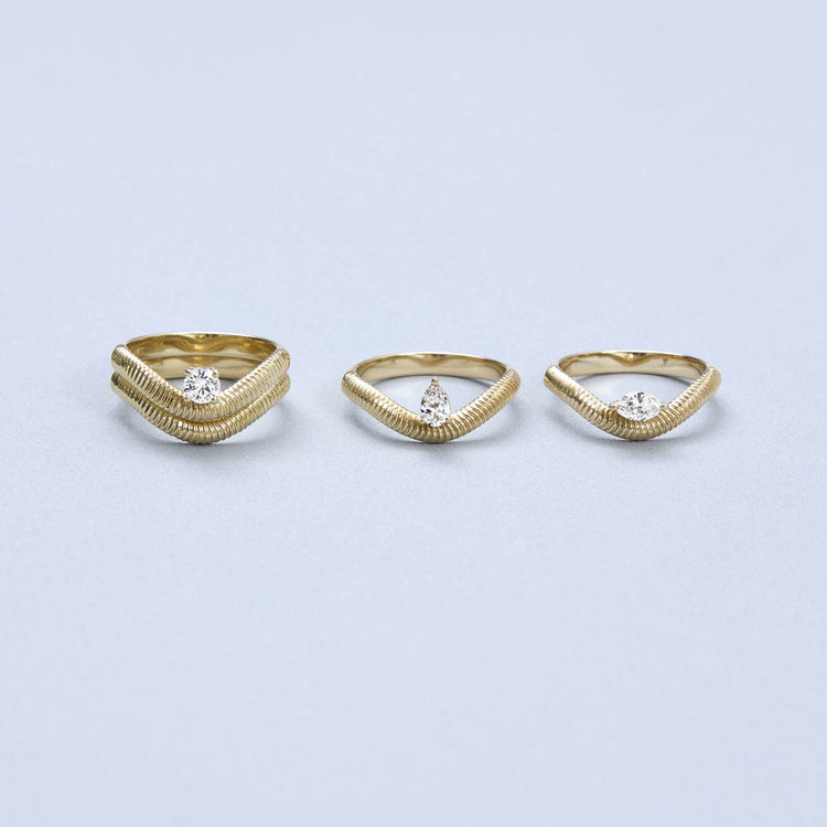 Still life image of The Janet Ring with Stone and Strand solid gold jewelry