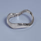 Stone and Strand Sterling Silver Contour Knife Edge Stacking Bangle Editorial Image