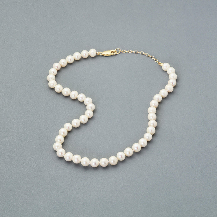 Stone and Strand 14K Yellow Gold Daily Pearl Necklace Editorial Image