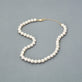 Stone and Strand 14K Yellow Gold Daily Pearl Necklace Editorial Image