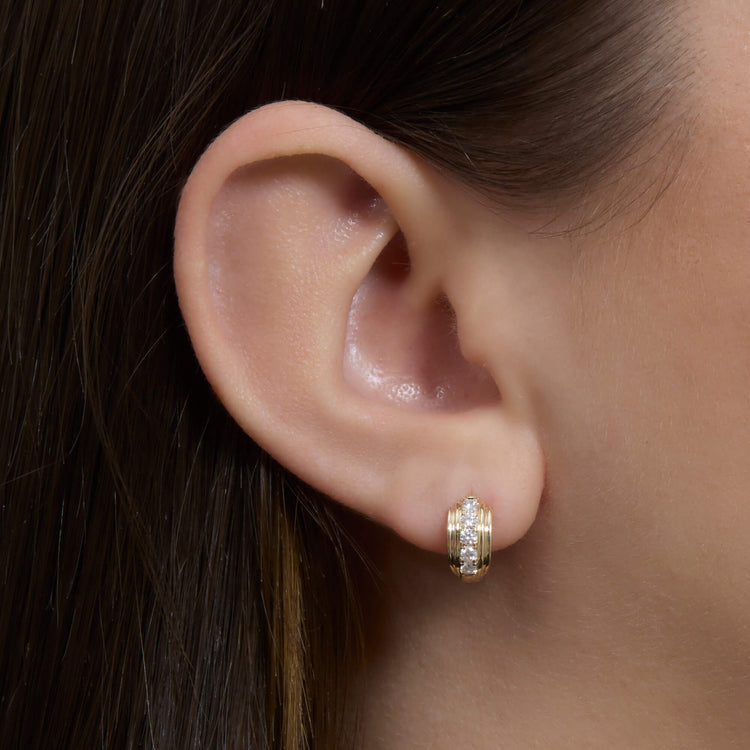 Image of 14K Yellow Gold Dainty Boulevard Huggies on Models Ear