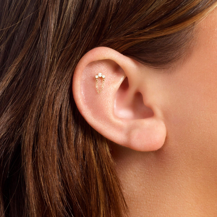 Image of 14K Yellow Gold Dainty Diamond Trio Chain Stud on Models Ear