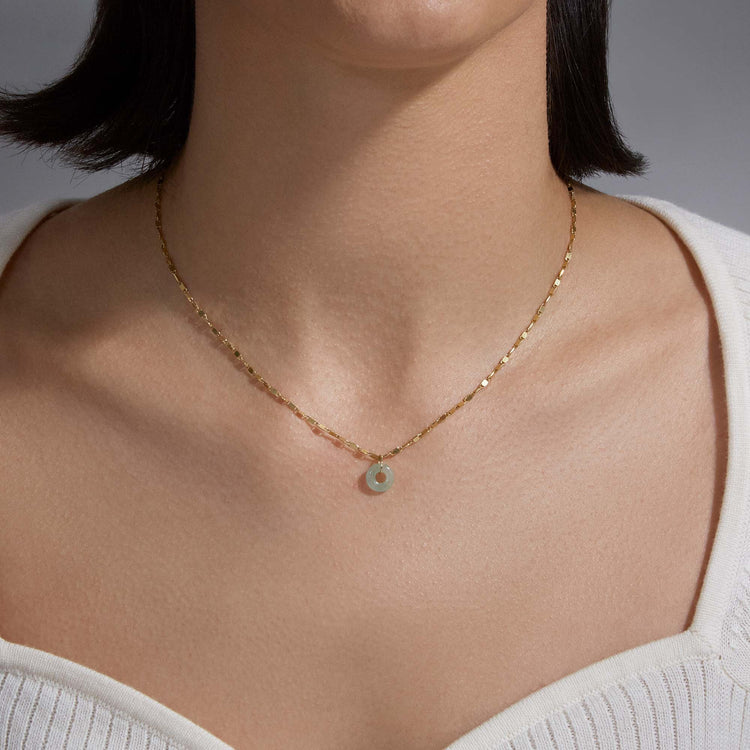 Image of 10K Yellow Gold Dainty Donut Aventurine Charm on Models Neck