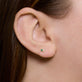 Image of 14K Yellow Gold Second Hole Green Goddess Diamond Buddy Studs with Emerald on Models Ear