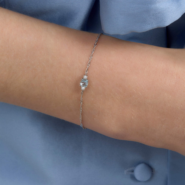 Image of 14K White Gold Delicate Aquamarine Cushion Bracelet on Models Arm