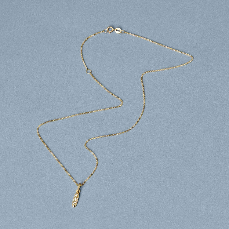 Stone and Strand 14K Yellow Gold Diamond Baguette Charm Editorial Image