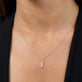 Image of 14K Yellow Gold Diamond Baguette Charm on Models Neck