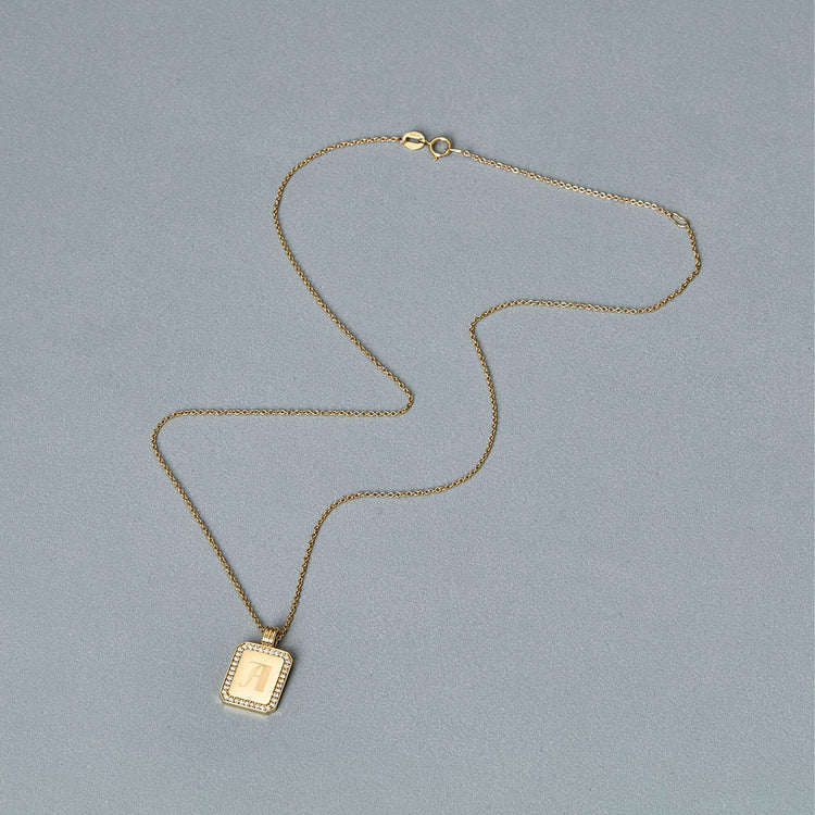 Stone and Strand 14K Yellow Gold Diamond Beekman Dog Tag Necklace Editorial Image