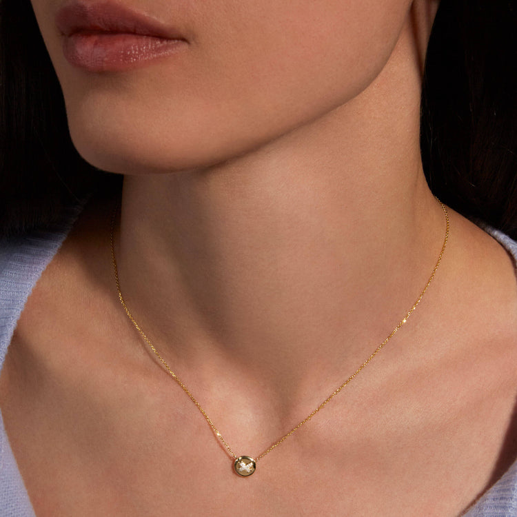 Image of 14K Yellow Gold Diamond Button Necklace on Models Neck
