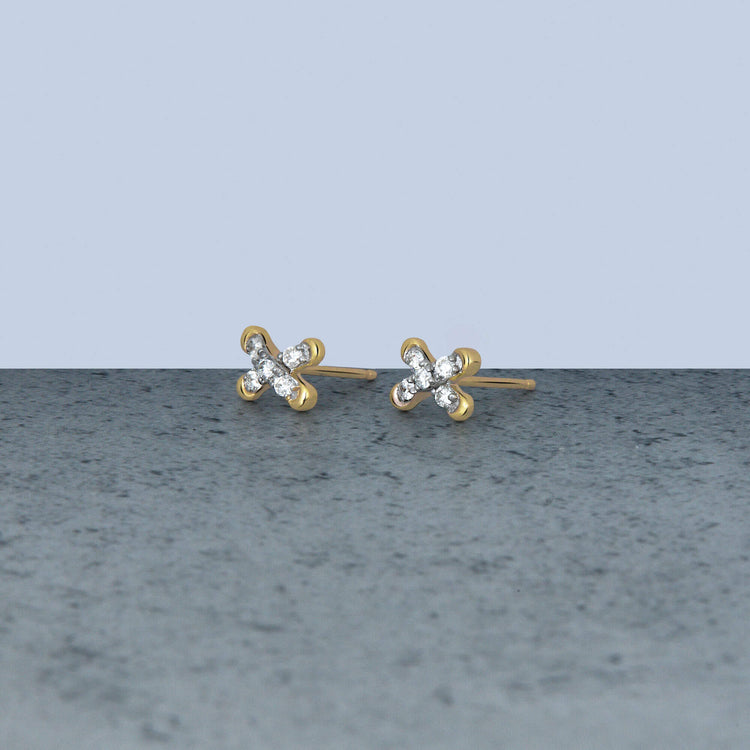 Stone and Strand 14K Yellow Gold Diamond Cross Stitch Studs Editorial Image